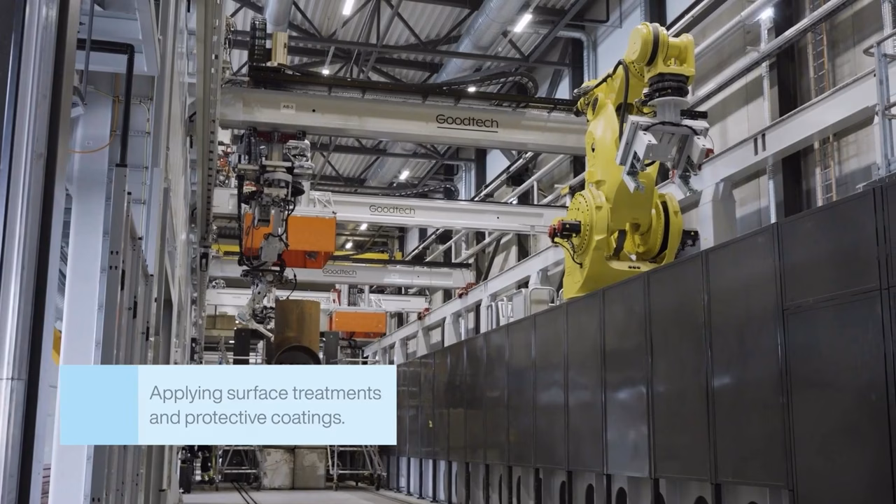 A robot arm working on a steel structure inside the Verdal Production Line hall